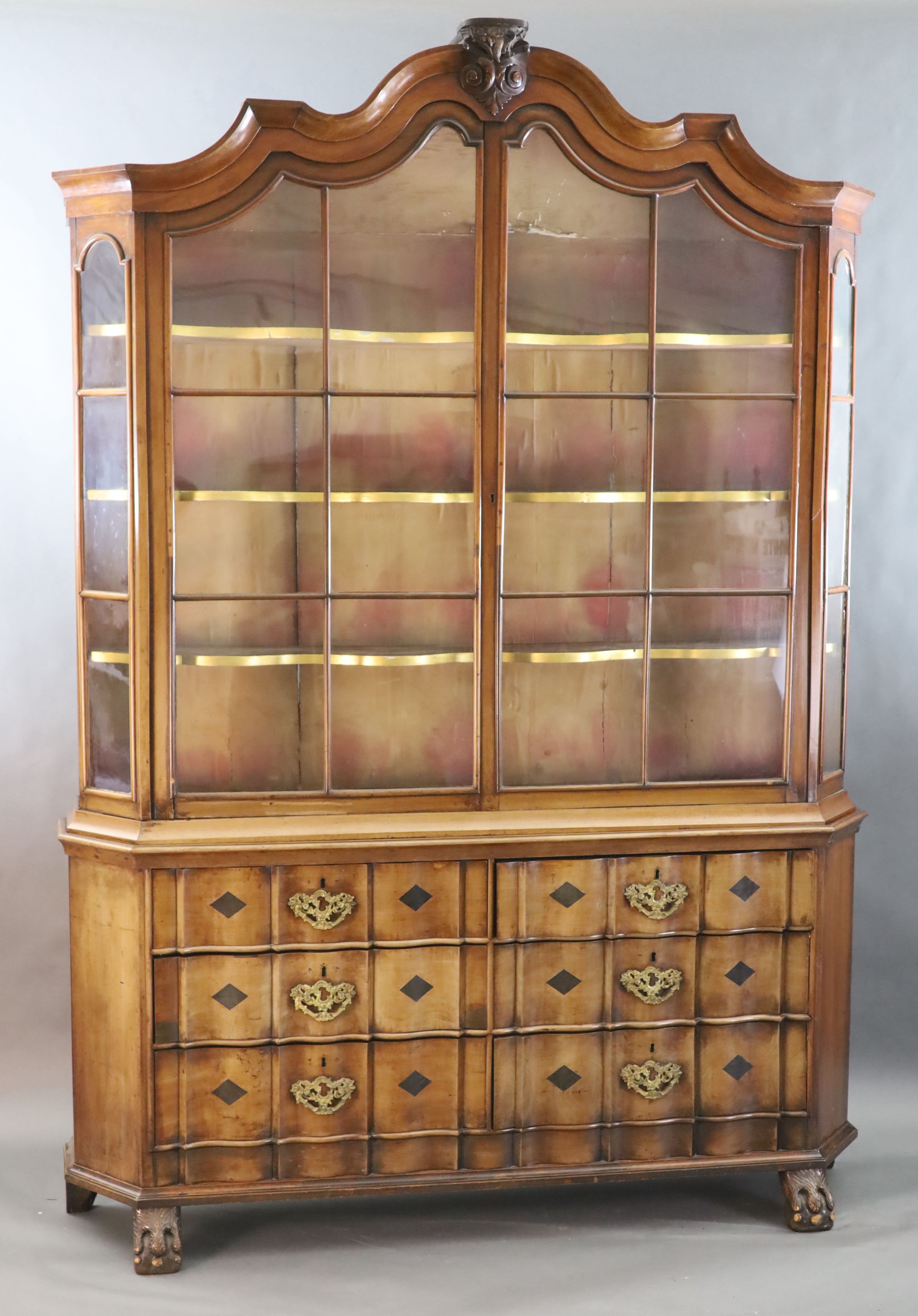 A late 18th century Dutch walnut serpentine vitrine, W.5ft 11in. D.1ft 4in. H.8ft 5in.